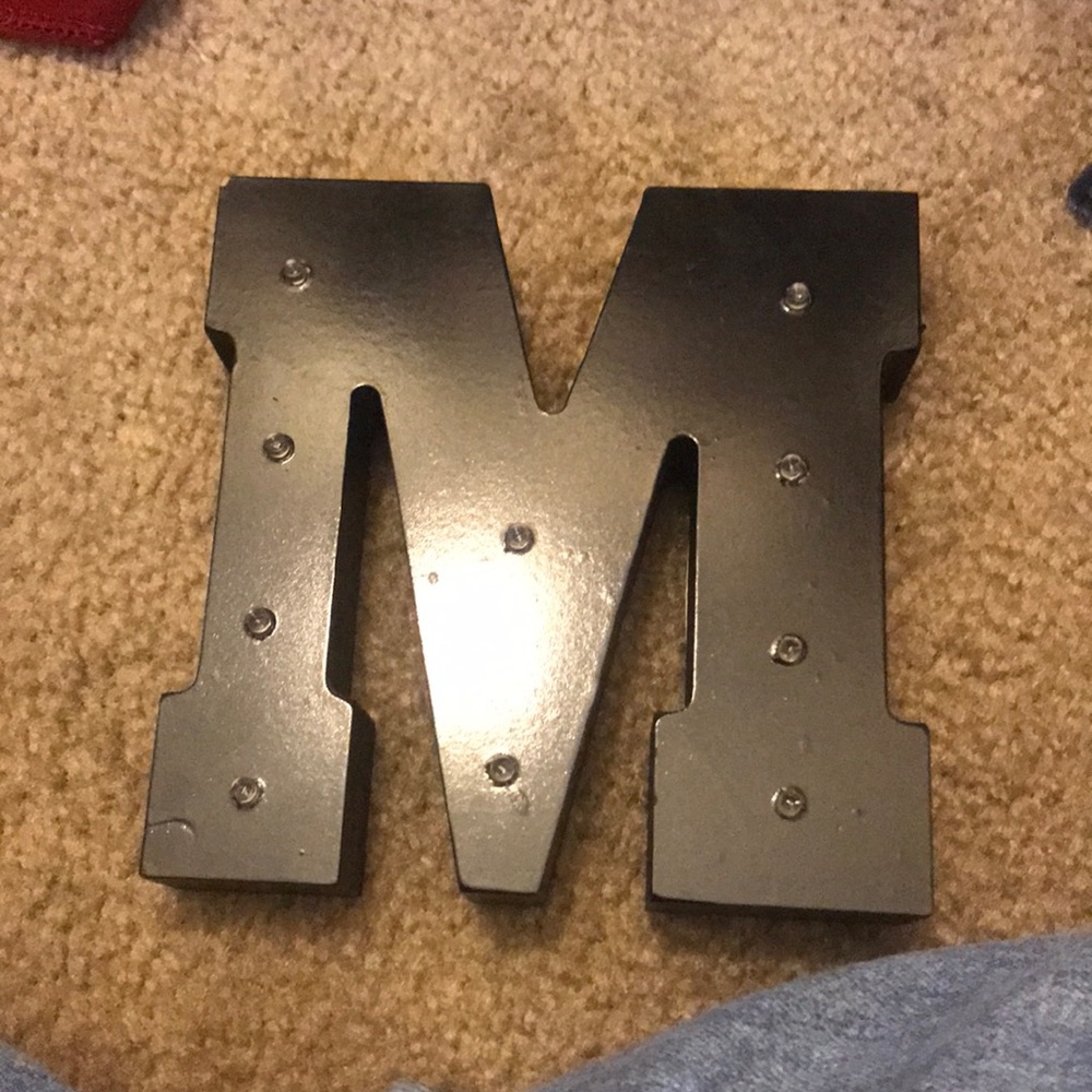 M sign